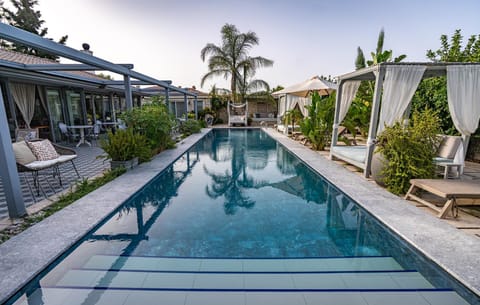 Property building, Pool view, Swimming pool, sunbed