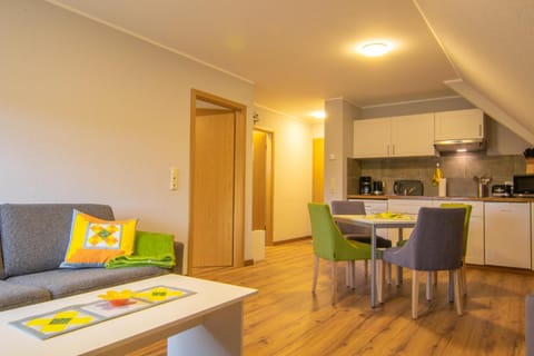 Kitchen or kitchenette, Living room, Seating area, Dining area