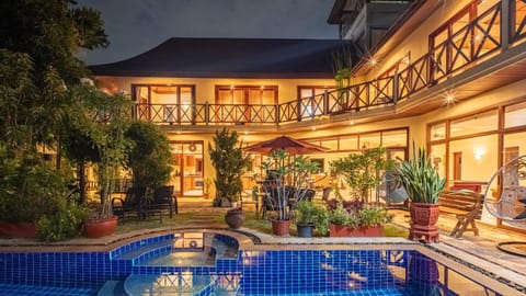 Property building, Patio, Night, Pool view, Swimming pool, sunbed
