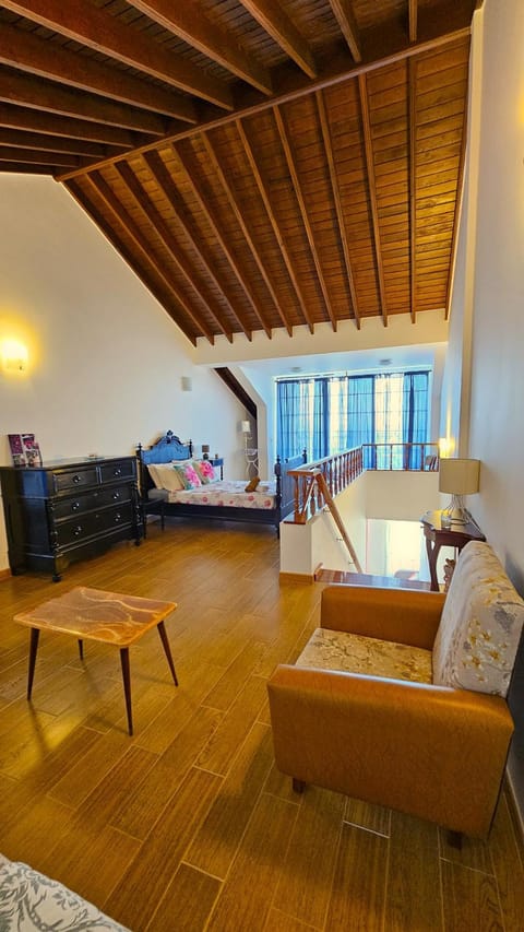 Bed, Living room, Seating area, Bedroom
