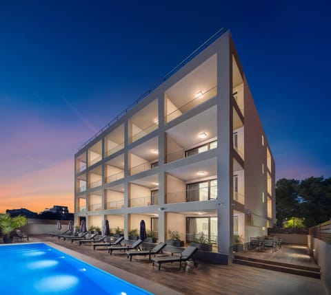 Property building, Patio, Swimming pool, Swimming pool, Sunset
