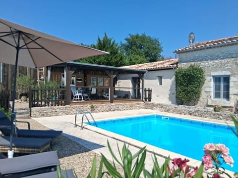Property building, Patio, Pool view, Swimming pool, sunbed