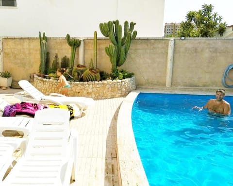 Swimming pool, sunbed