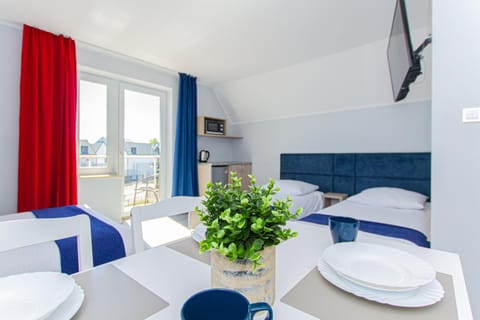 Communal lounge/ TV room, Bed, Seating area, Dining area, Bedroom