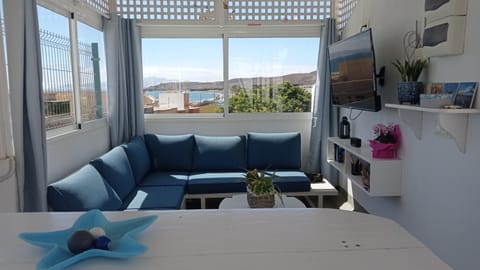 View (from property/room), Balcony/Terrace, Living room, Seating area, Beach, Sea view