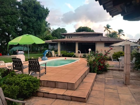Property building, Patio, Garden, Living room, Garden view, Pool view, Swimming pool, sunbed