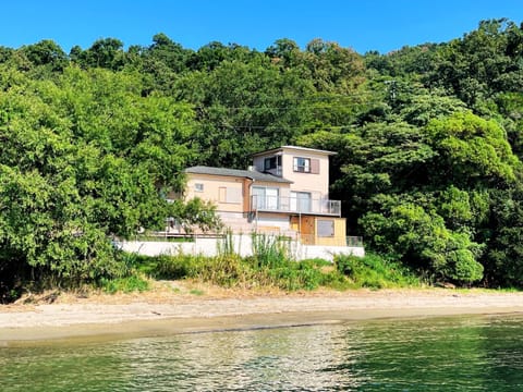 Property building, Day, Natural landscape, Beach, Sea view