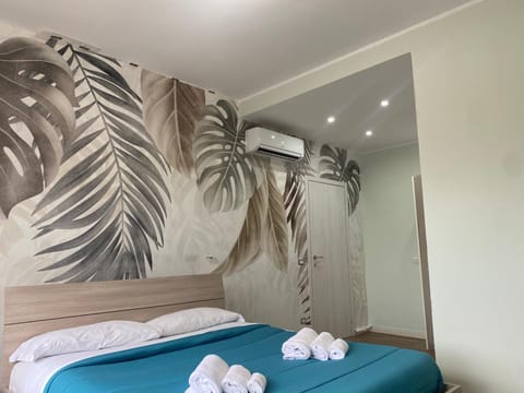 Bed, Photo of the whole room, Decorative detail, Bedroom, towels, air conditioner