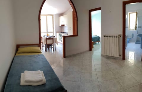 Bed, Living room, Seating area, Dining area