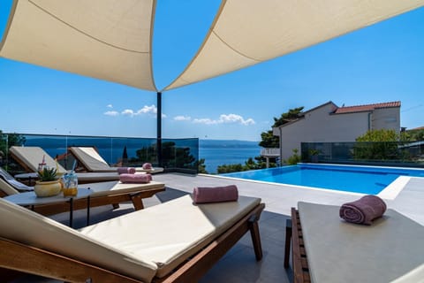 Property building, Balcony/Terrace, Seating area, Sea view, Swimming pool