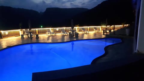Property building, Night, Natural landscape, Mountain view, Pool view, Swimming pool, Swimming pool, sunbed