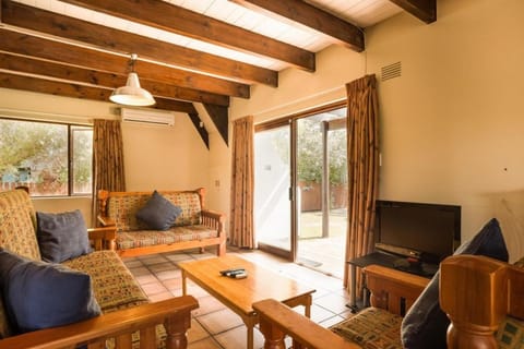 TV and multimedia, Living room, Seating area, Garden view, Pool view