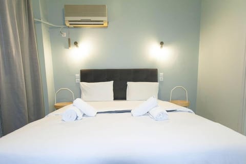 Bed, Photo of the whole room, Bedroom, towels, air conditioner