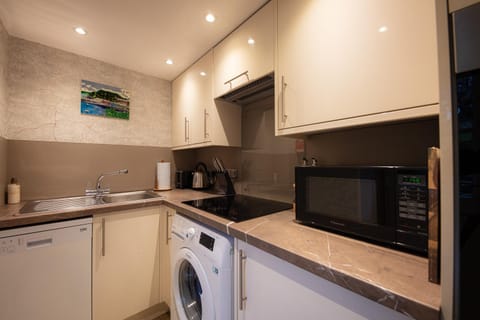 microwave, stove, washing machine, kitchen