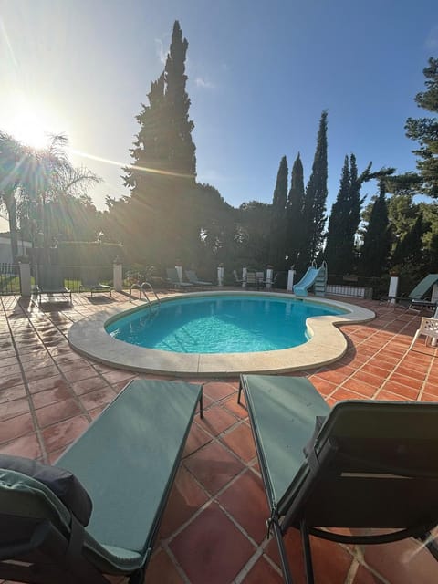 Patio, Day, Natural landscape, Pool view, Swimming pool, sunbed