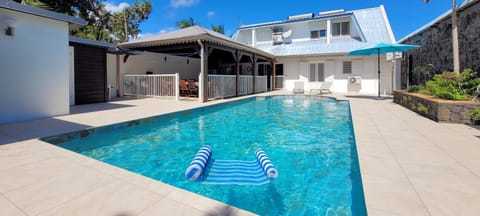 Property building, Patio, Pool view, Swimming pool, sunbed