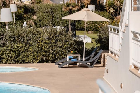 Property building, Patio, Staff, Spring, Day, Night, People, Summer, Garden, View (from property/room), Other, Decorative detail, Autumn, Text overlay, Guests, Garden view, Landmark view, Pool view, Street view, Area and facilities, Swimming pool, Seasons, Time of day, Sunrise, Sunset, children, young children, older children, group of guests, Family, Parking, concierge, furniture, internet, locker, safe, sunbed, towels, VIP, wedding, air conditioner