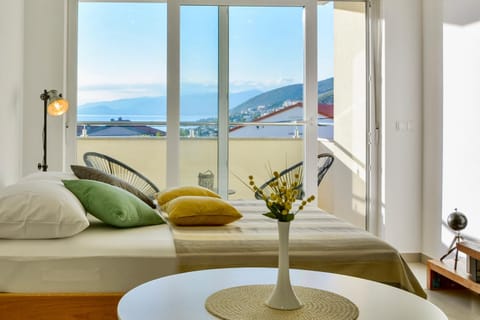 Bed, Living room, Seating area, Bedroom, Sea view