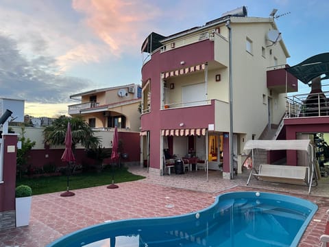 Property building, Patio, Day, Pool view, Swimming pool, sunbed