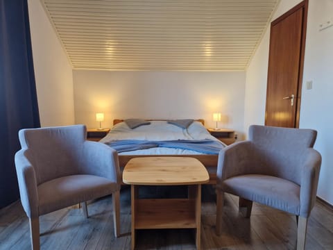 Bed, Seating area, Bedroom