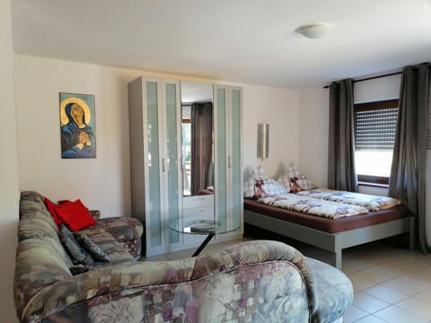 Bed, Living room, Seating area, Bedroom