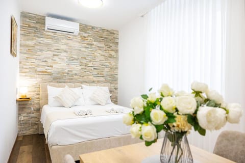 Bed, Photo of the whole room, Bedroom, towels, air conditioner