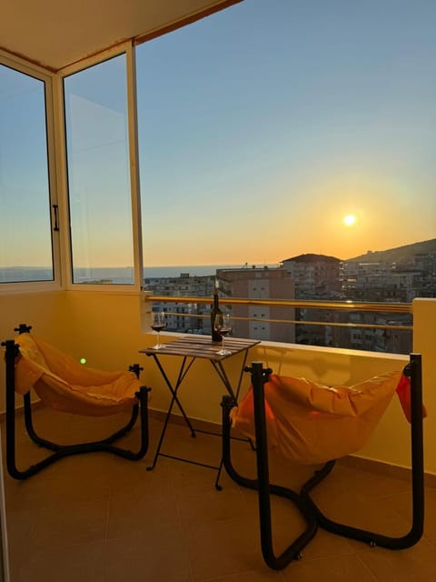 View (from property/room), Balcony/Terrace, Seating area, Sea view, Sunset