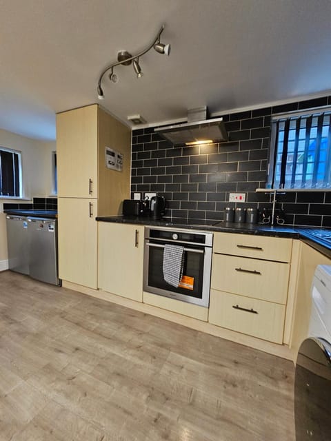 Kitchen or kitchenette, oven, stove, washing machine