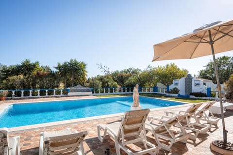Patio, Natural landscape, Pool view, sunbed