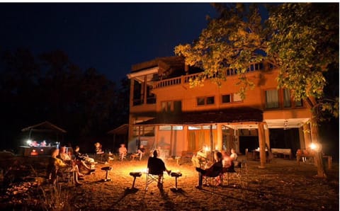 Property building, Night, Natural landscape, Seating area, group of guests