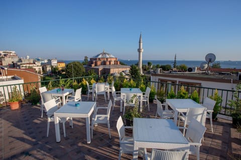 Property building, Patio, Day, Natural landscape, View (from property/room), Balcony/Terrace, Dining area, City view, Sea view
