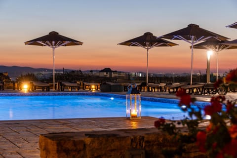 Patio, Nearby landmark, Staff, Spring, Day, Night, People, People, People, Natural landscape, Summer, View (from property/room), Other, Autumn, Text overlay, Guests, Pool view, Pool view, Area and facilities, Swimming pool, Swimming pool, Swimming pool, Seasons, Time of day, Sunrise, Sunset, young children, older children, group of guests, group of guests, Family, concierge, furniture, internet, soundproof, sunbed, towels, VIP, wedding, air conditioner