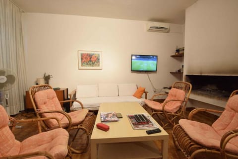 TV and multimedia, Living room, Seating area, fireplace, air conditioner