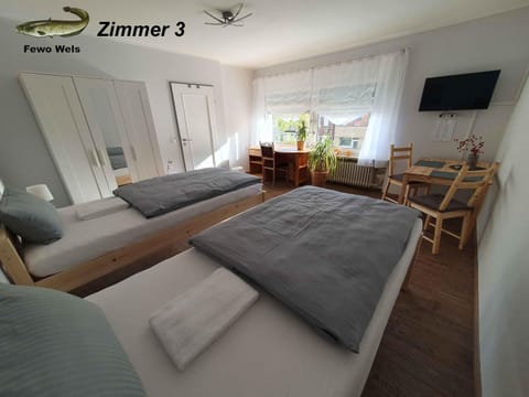 Bed, TV and multimedia, Living room, Seating area, Bedroom