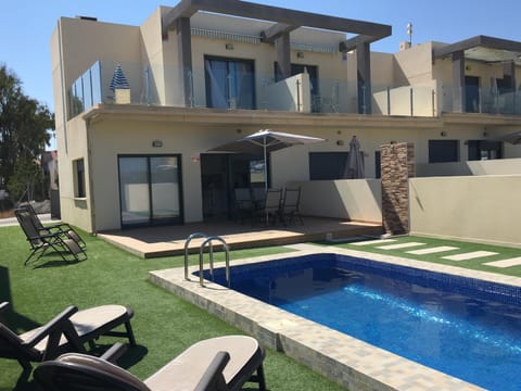 Property building, Patio, Garden, Pool view, Swimming pool, sunbed