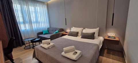 Bed, Living room, Photo of the whole room, Seating area, Bedroom, towels