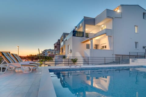 Property building, Swimming pool, Swimming pool, Sunset