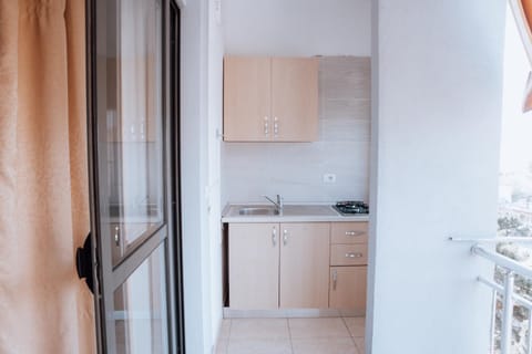 Kitchen or kitchenette, stove