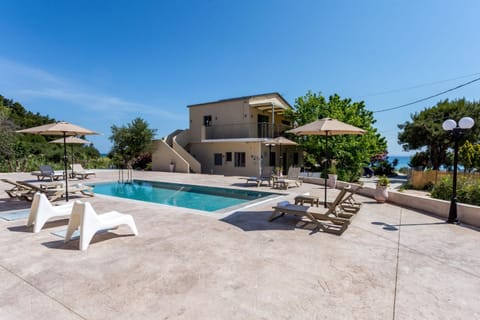 Property building, Patio, Day, Natural landscape, Pool view, Swimming pool