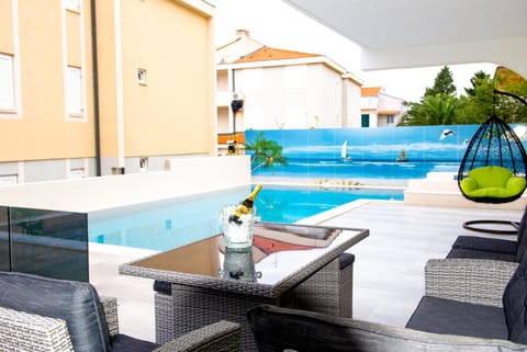 Patio, Day, Seating area, Pool view, Swimming pool, sunbed