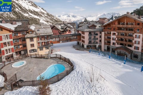 Property building, Nearby landmark, Facade/entrance, Day, Neighbourhood, Natural landscape, Winter, Mountain view, Pool view, Swimming pool
