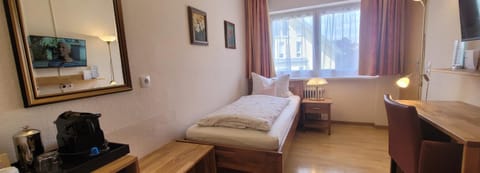 Bed, TV and multimedia, Seating area, Bedroom, hair dresser