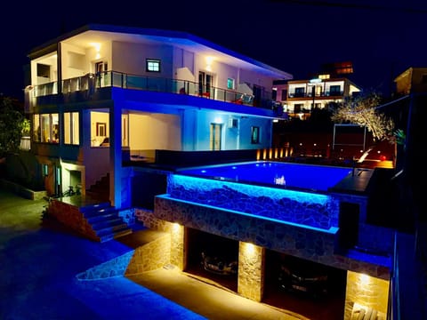 Property building, Night, Pool view, Swimming pool, Swimming pool, sunbed