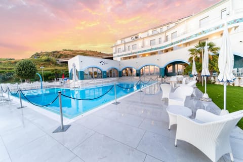 Property building, Patio, Natural landscape, Pool view, Swimming pool, sunbed