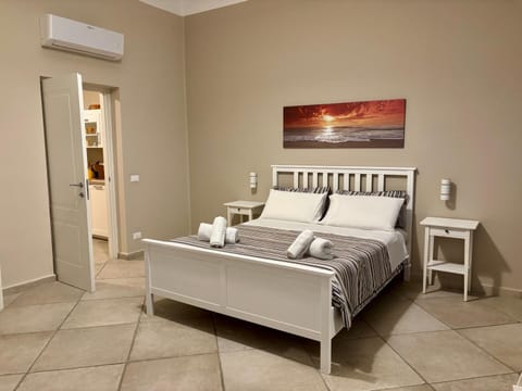 Bed, Photo of the whole room, Bedroom, towels, air conditioner