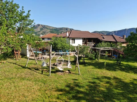 Property building, Spring, Day, Natural landscape, Garden, Seating area, Garden view, Mountain view