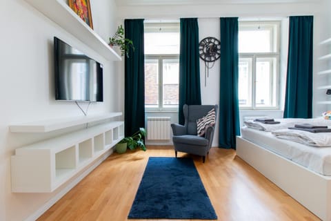 Bed, Living room, Seating area, Bedroom