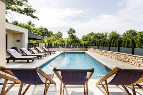 Patio, Day, Natural landscape, Pool view, Swimming pool, sunbed