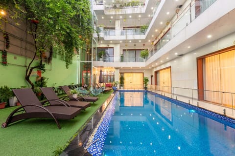 Property building, Patio, Pool view, Swimming pool, sunbed