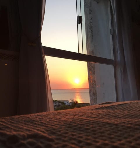 Bed, Natural landscape, View (from property/room), Sea view, Sunset
